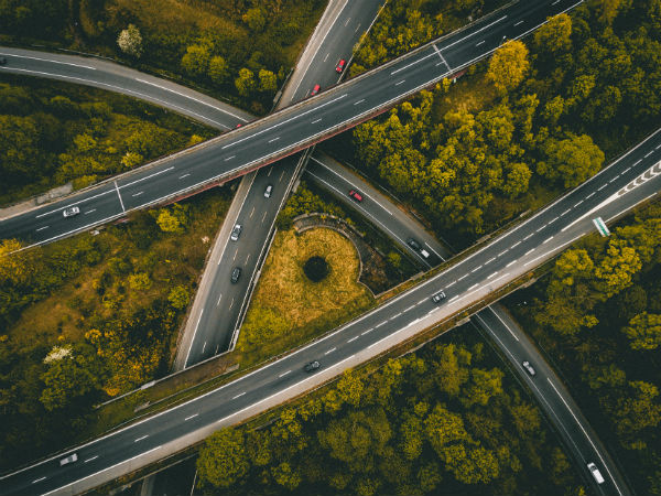 Aerial view of highway overpasses in a wooded area