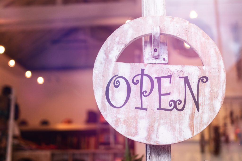 Photo of an open sign on a shop door