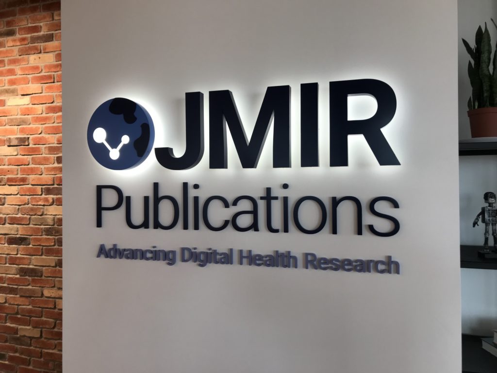 Sign in an office reading "JMIR Publications, Advancing Digital Health Research"